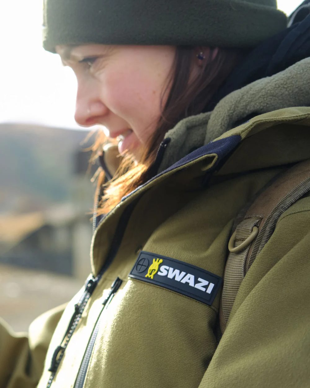 Tussock Green coloured Swazi Womens Artemis Jacket on nature backgorund #colour_tussock-green