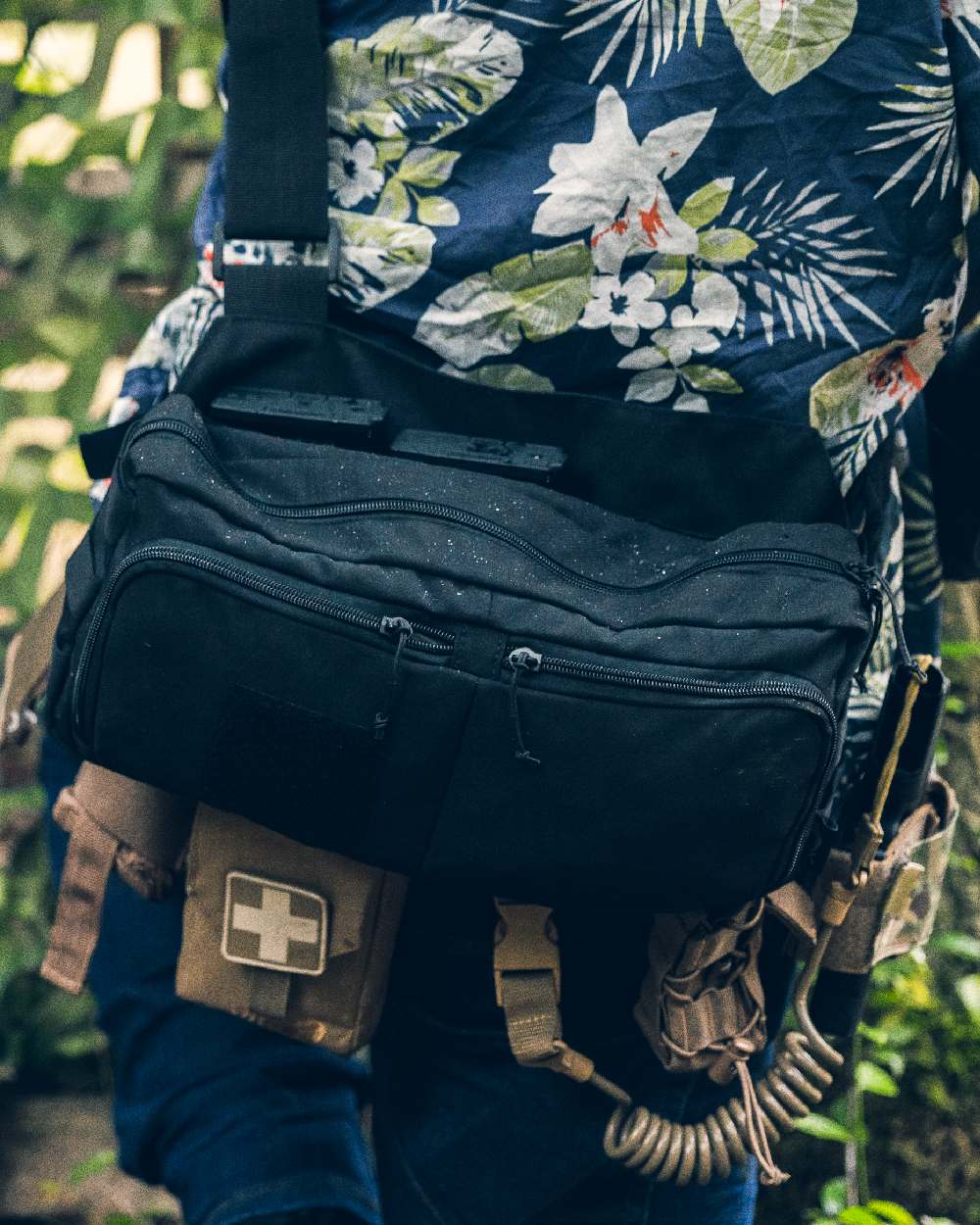 Black Coloured Viper VX Buckle Up Sling Pack on blurry background #colour_black