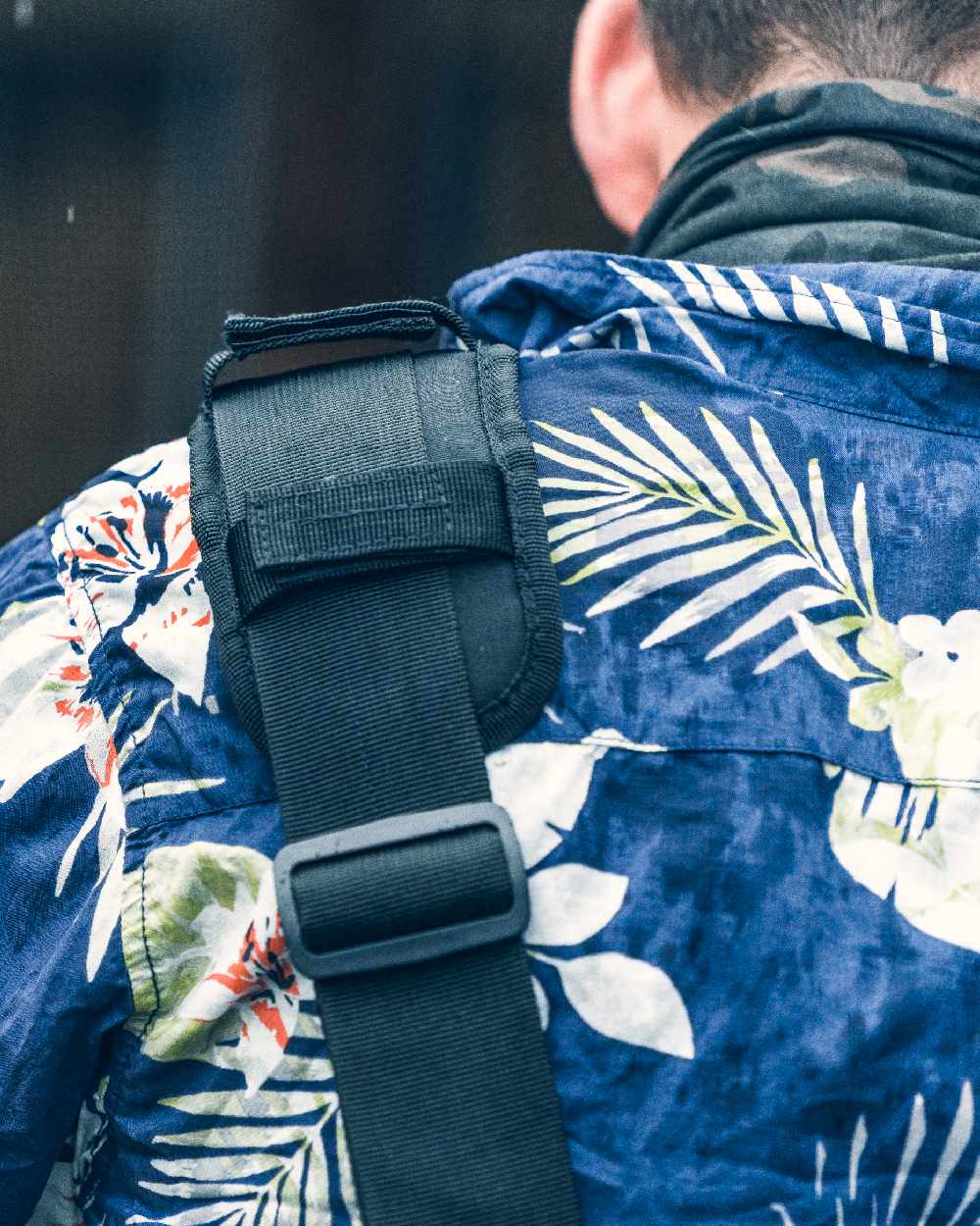 Black Coloured Viper VX Buckle Up Sling Pack on blurry background #colour_black