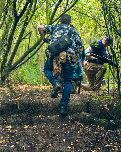 Black Coloured Viper VX Buckle Up Sling Pack on forest background #colour_black