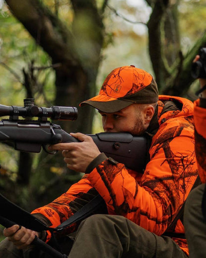 Realtree Edge Orange Coloured Deerhunter Eagle Cap On A Forest Background #colour_realtree-edge-orange