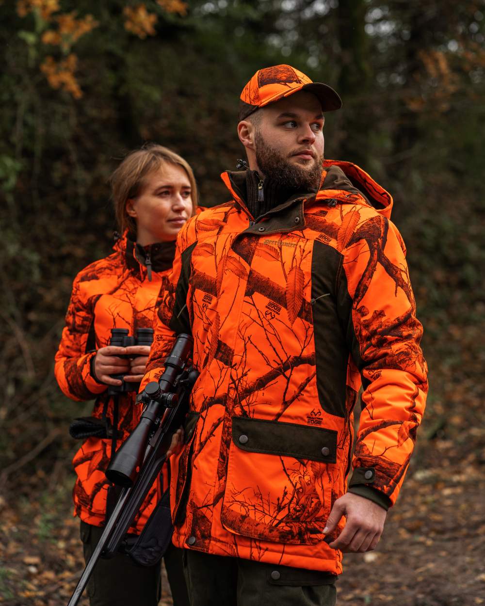 Realtree Edge Orange Coloured Deerhunter Eagle Cap On A Forest Background #colour_realtree-edge-orange