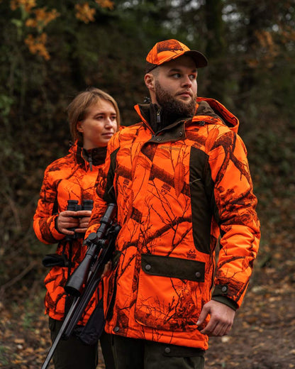 Realtree Edge Orange Coloured Deerhunter Eagle Cap On A Forest Background #colour_realtree-edge-orange