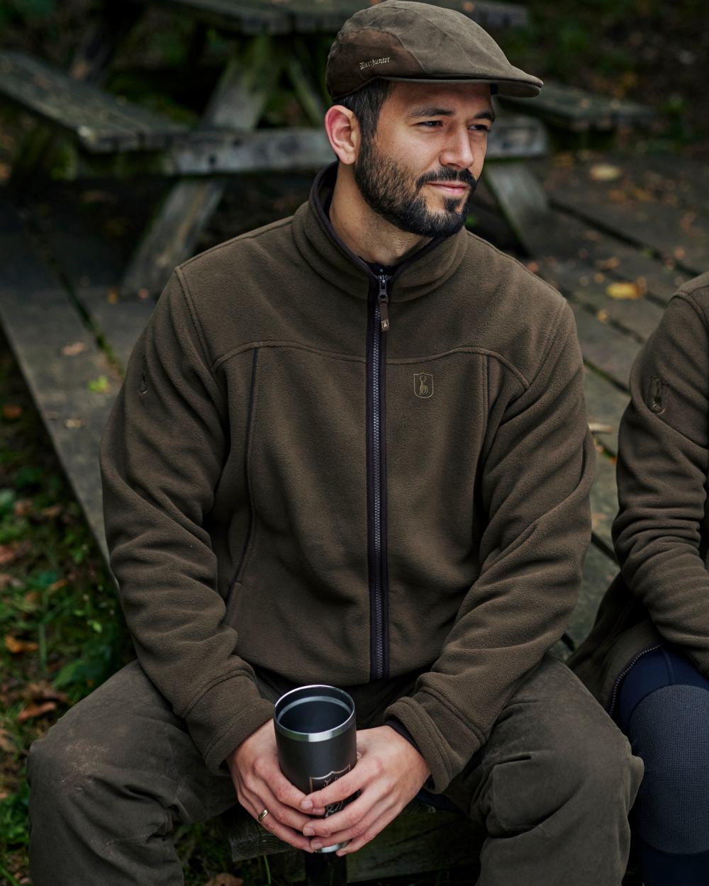 Tarmac Green coloured Deerhunter Eagle Trouser on a forest background #colour_tarmac-green