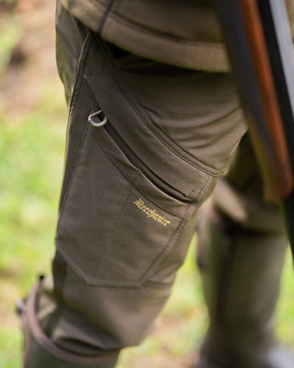 Bark Green coloured Deerhunter Northward Trousers on Outdoor Background #colour_bark-green