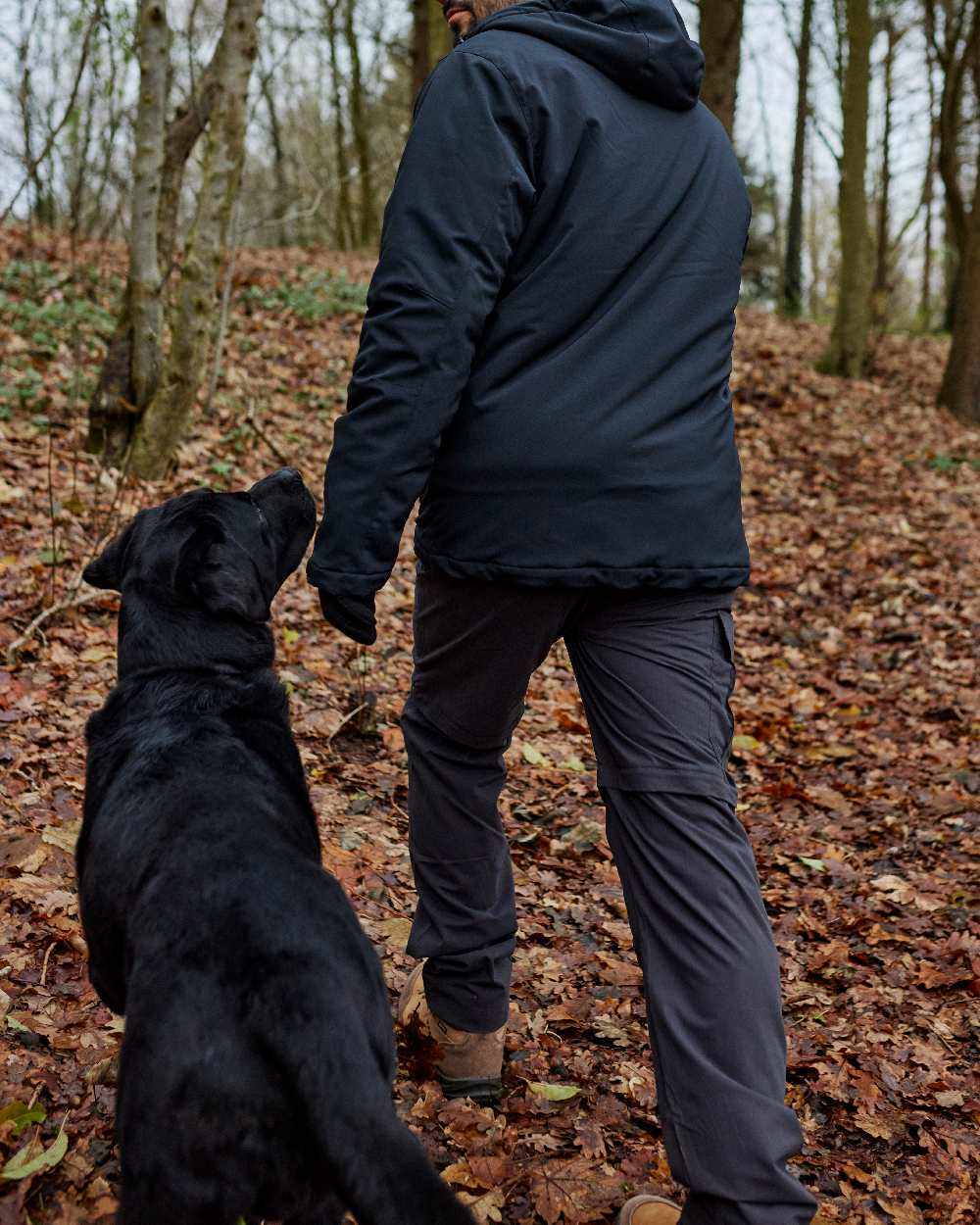Black Ink coloured Deerhunter Slogen Zip-off Trousers on Forest background #colour_black-ink