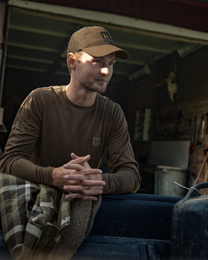 Shadow Brown Coloured Harkila Base All Season Long Sleeve T-Shirt On A Backyard Background #colour_shadow-brown