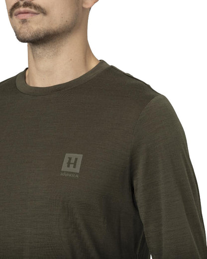Willow Green Coloured Harkila Base All Season Long Sleeve T-Shirt On A White Background #colour_willow-green