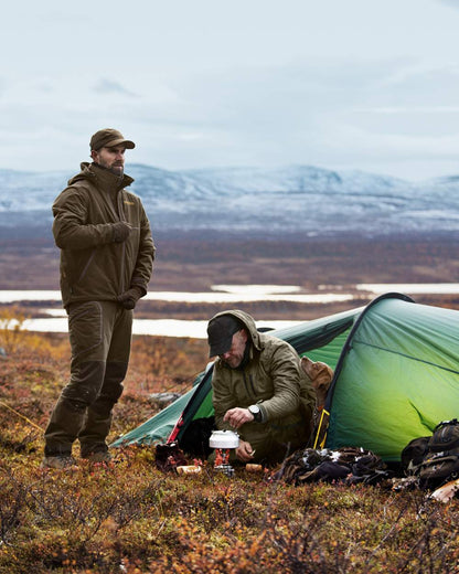 Hunting Green Shadow Brown Coloured Harkila Mountain Hunter Jacket on outdoor background #colour_hunting-green-shadow-brown