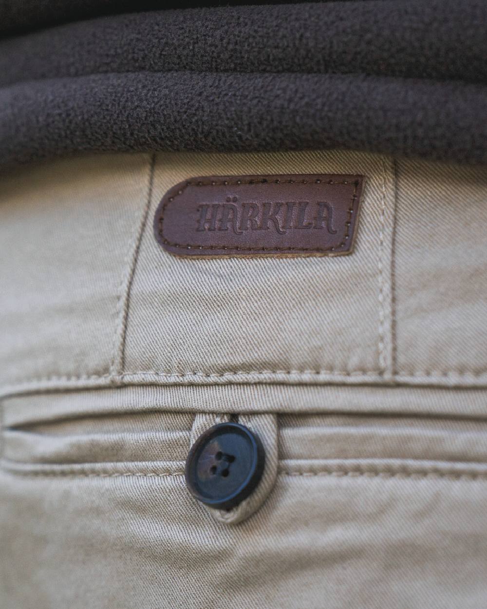 Sand Coloured Harkila Norberg Chinos on white background #colour_sand