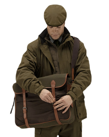 Warm Olive Coloured Harkila Retrieve Game Bag on white background #colour_warm-olive