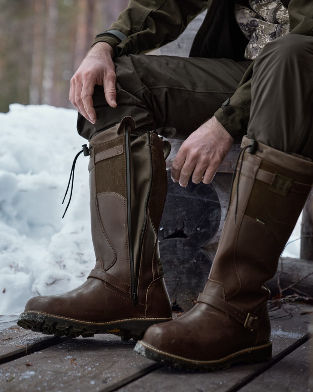 Willow Green Shadow Brown Coloured Harkila Visent 2.0 GTX Boots on snow background #colour_willow-green-shadow-brown
