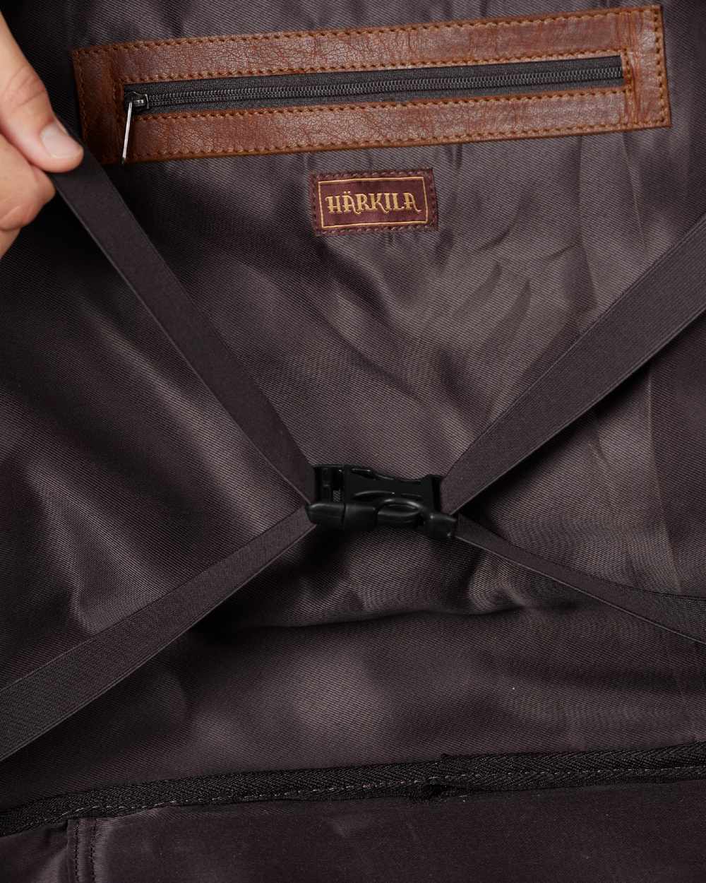 Warm Olive Coloured Harkila Weekend Bag 30L on blurry background #colour_warm-olive