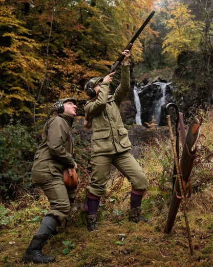 Olive Coloured Harkila Womens Jura GTX Knee Length Trousers on outdoor background #colour_olive