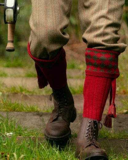 Brick Red Coloured House of Cheviot Chessboard Socks On A Forest Background #colour_brick-red