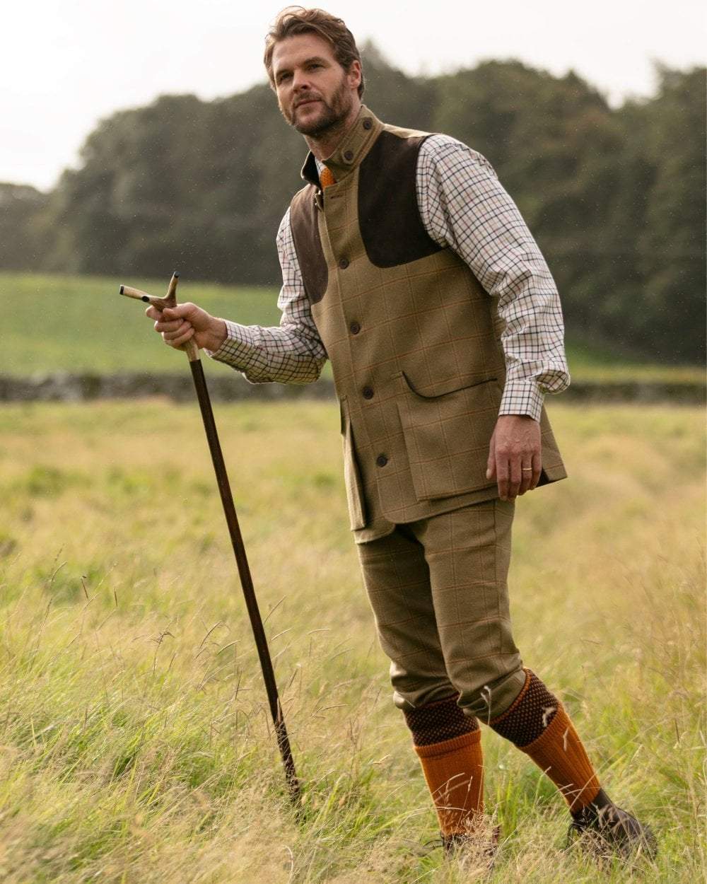 Ochre coloured House of Cheviot Tayside Socks on field background #colour_ochre
