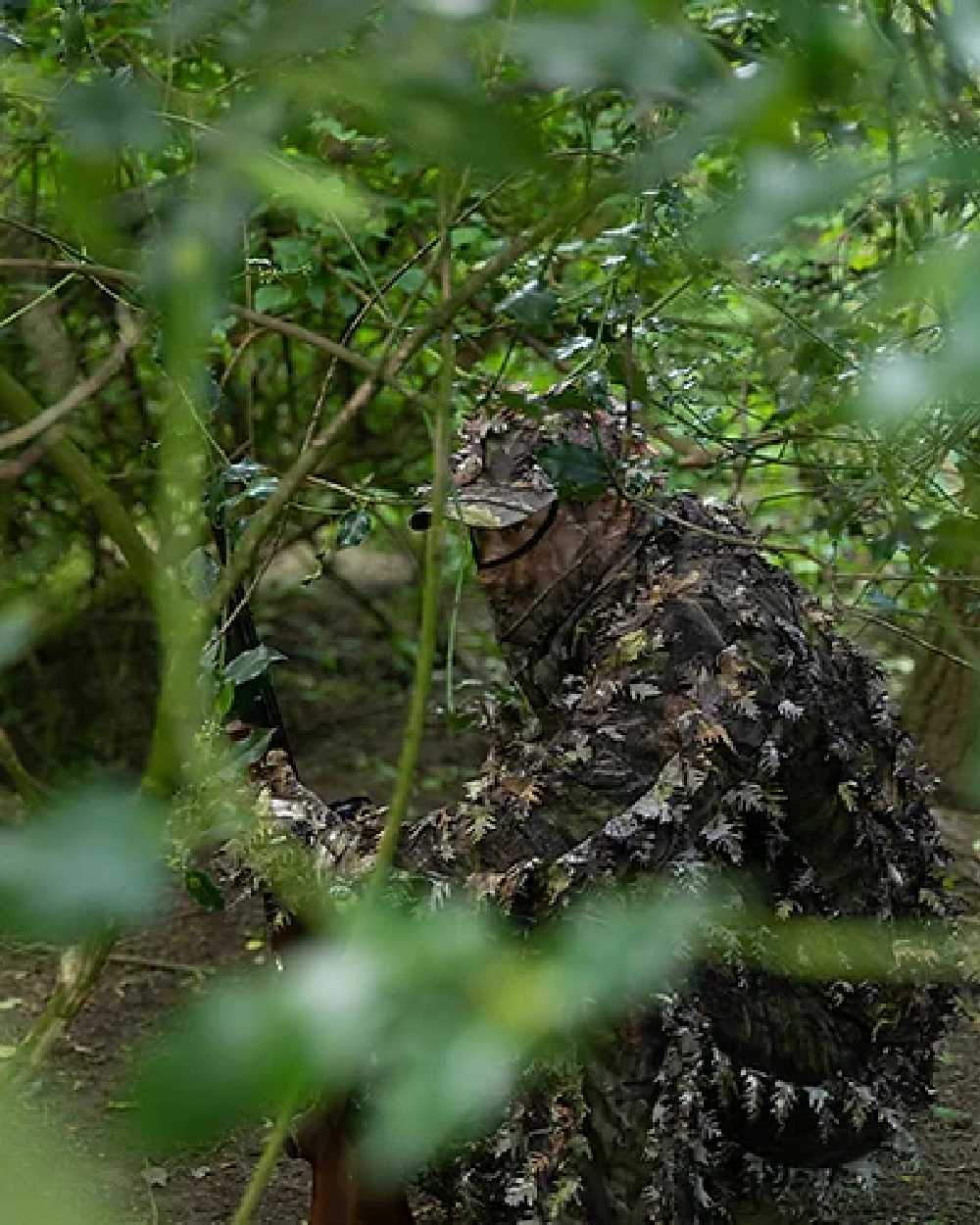 EVO coloured Jack Pyke LLCS 3D Concealment Suit on forest background #colour_evo