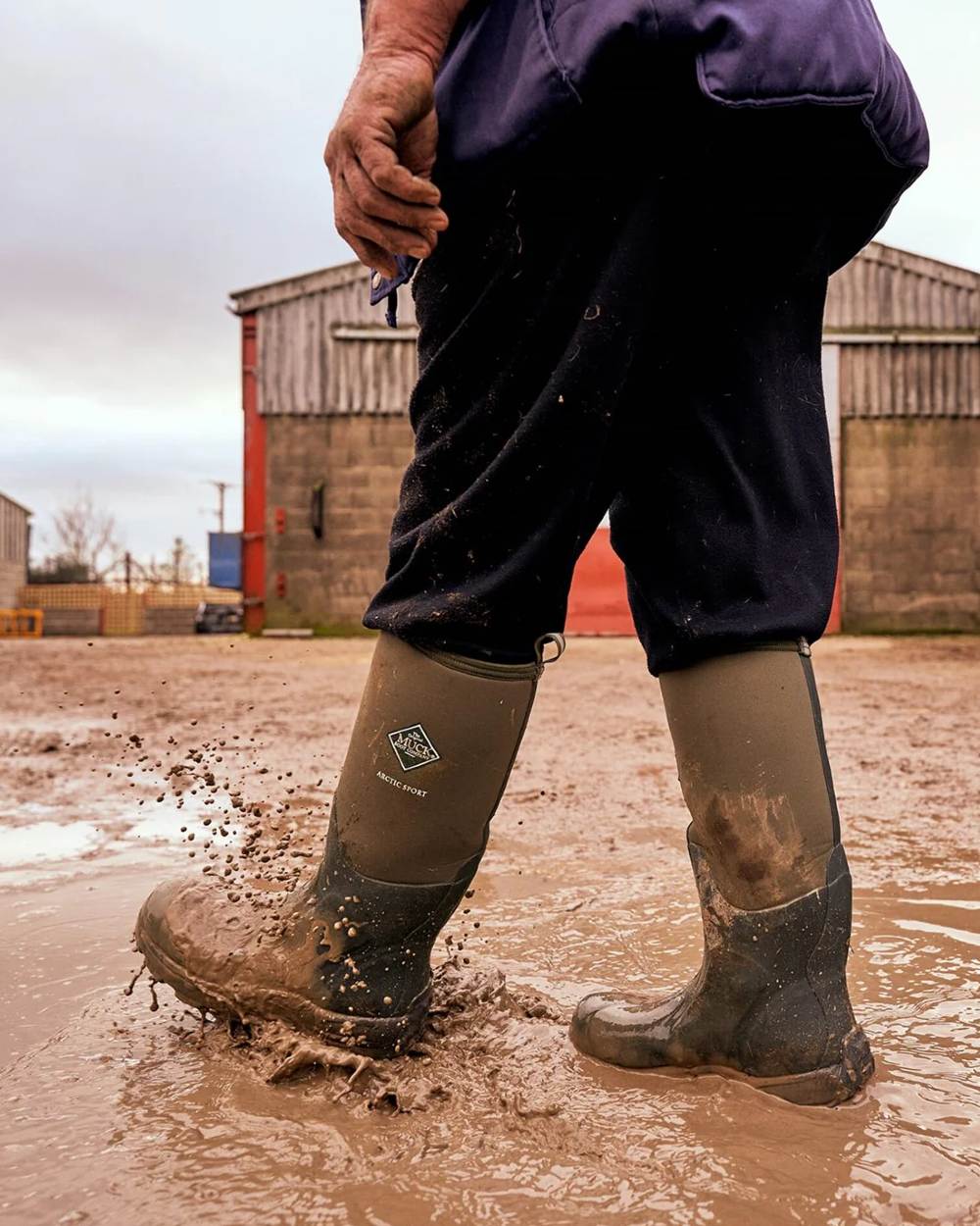 Moss Coloured Muck Boots Arctic Sport Tall Wellingtons On A Shelter Background #colour_moss