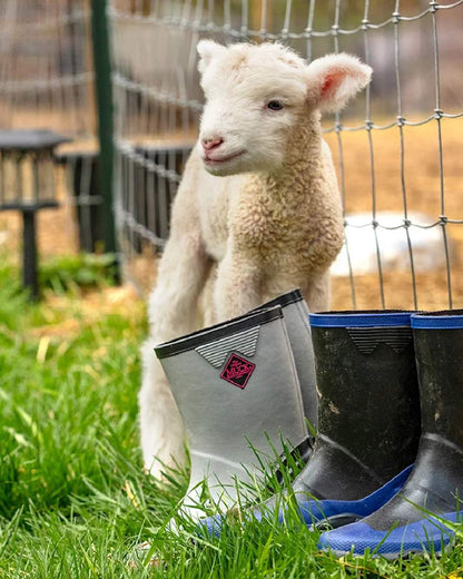 Grey Pink Coloured Muck Boots Childrens Forager Tall Boots on Outdoor Background
#colour_grey-pink