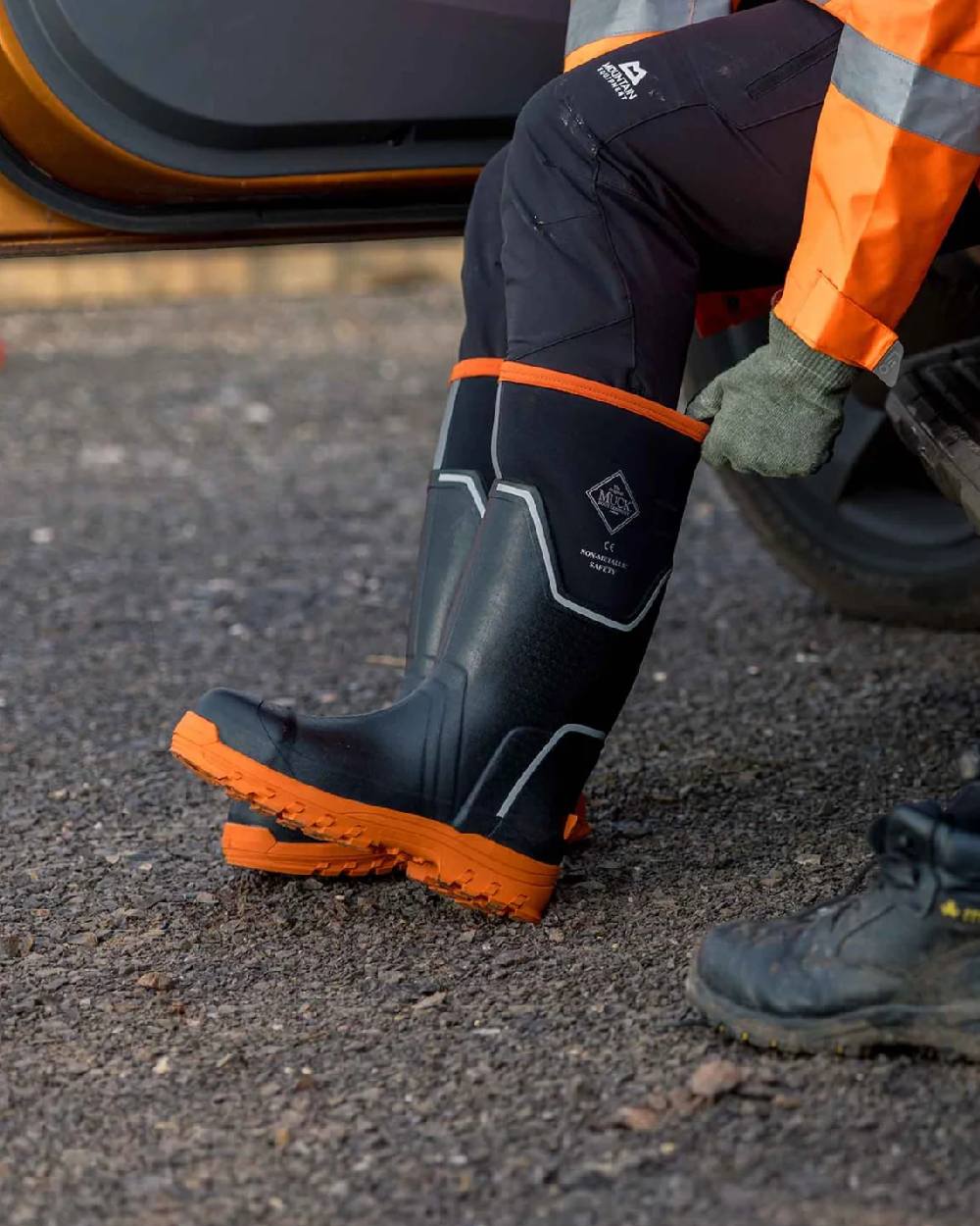 Black Orange Coloured Muck Boots Mens Grit S5 Tall Boots on Outdoor Background
#colour_black-orange