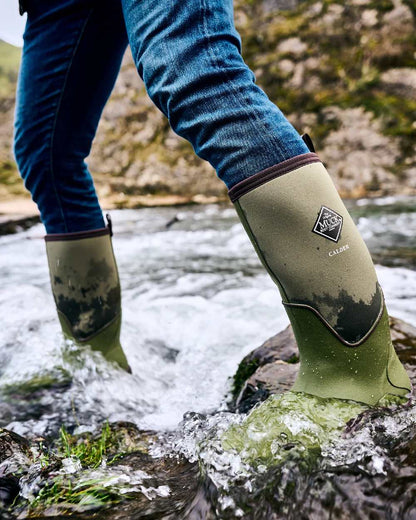Olive Coloured Muck Boots Unisex Calder Short Boots On A Sea Background #colour_olive
