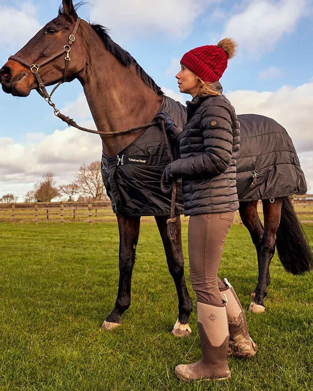 Chocolate Brown Walnut Woven Muck Boots Womens Artic Sport II Tall Wellingtons on Horse Pen background #colour_brown