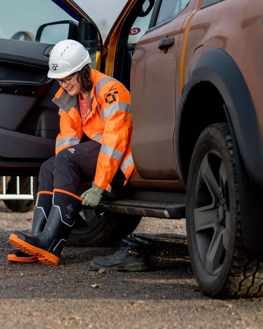 Black Orange Coloured Muck Boots Womens Grit S5 Tall Boots on Outdoor Background
#colour_black-orange