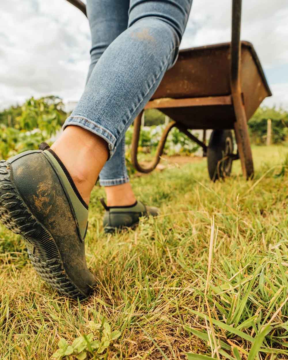 Green coloured Muck Boots Womens RHS Muckster II Low Shoes on Grassy background #colour_green