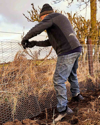 Black Coloured Muck Boots Mens Woody Sport Ankle Boots On A Field Background #colour_black