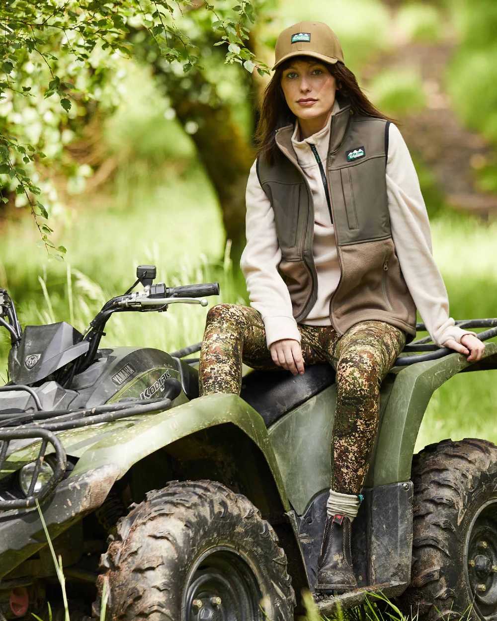 Light Bark Coloured Ridgeline Ladies Hybrid Fleece Vest On A Forest Background #colour_light-bark