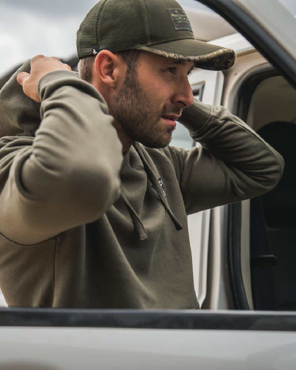 Grape Leaf Coloured Seeland Delta Hoodie on Blurry Background
#colour_grape-leaf