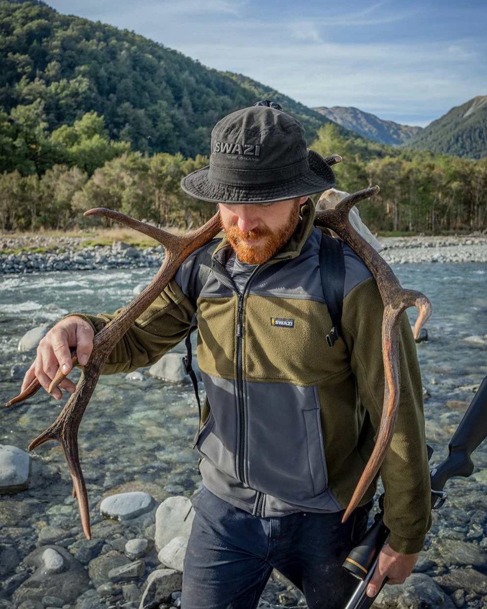 Black Coloured Swazi Bucket Hat On A River Background #colour_black