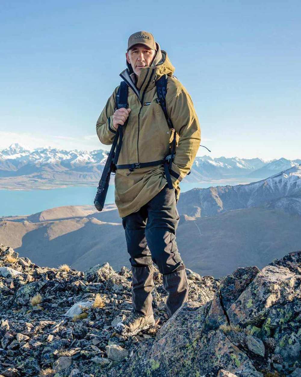 Tussock Green Coloured Swazi Tahr Xp Smock on mountain background #colour_tussock-green