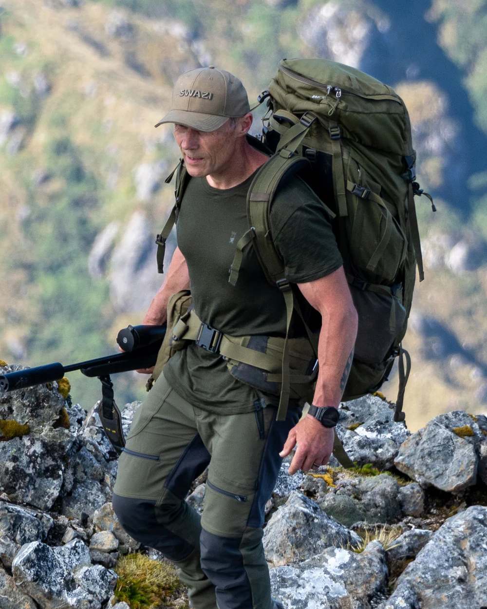 Olive Coloured Swazi The Hoodoo Long Sleeve T-Shirt On A Mountain Background #colour_olive