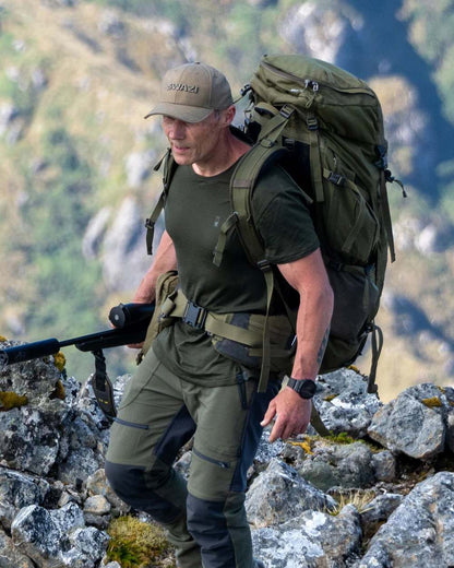 Olive Coloured Swazi The Hoodoo Long Sleeve T-Shirt On A Mountain Background #colour_olive